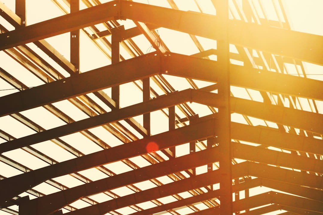 Steel I-beam roof framing on a metal building under construction