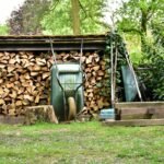 Split firewood stacked neatly under a roofed firewood shed